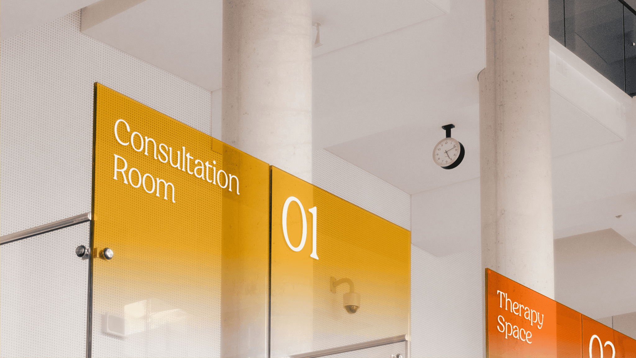 Clinic signs in orange and yellow: "Consultation Room 01" and "Therapy Space 02"