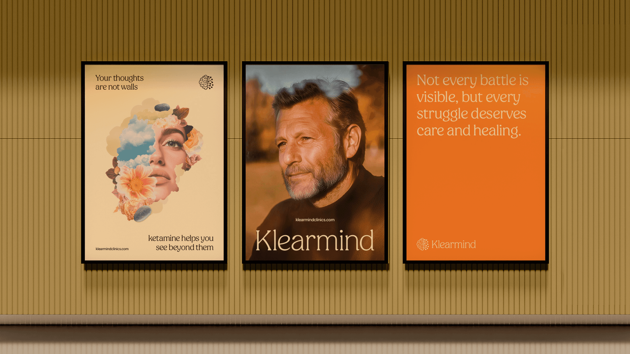 Three Klearmind posters on a wall: a collage, a portrait of a man, and an orange poster with a short message